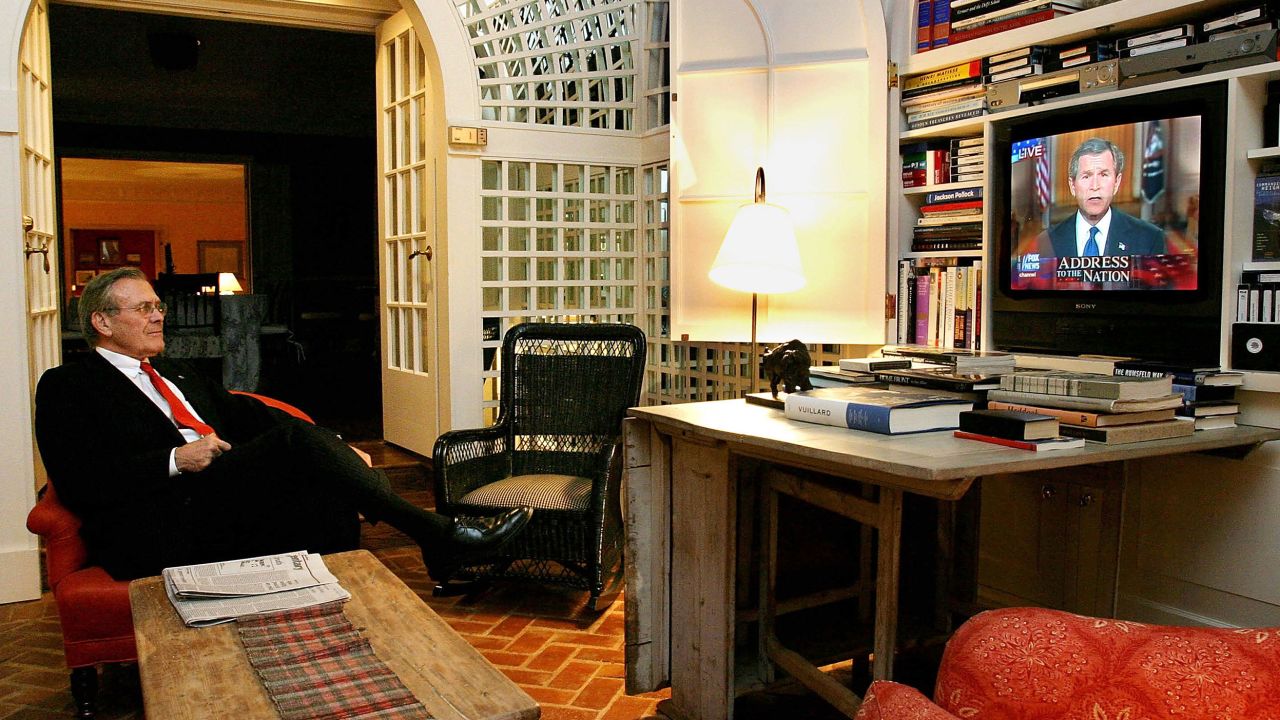 US Secretary of Defense Donald Rumsfeld watches President George W. Bush's speech from his home March 17, 2003, in Washington, DC.