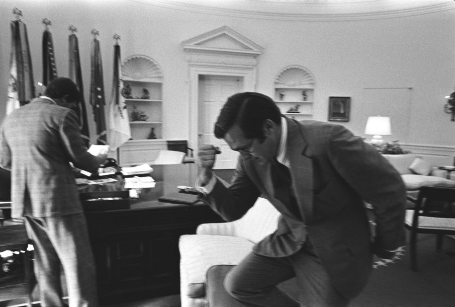 Rumsfeld pumps his fist while working in the White House Oval Office in 1974. Rumsfeld was White House chief of staff before becoming President Gerald Ford's secretary of defense in 1975.