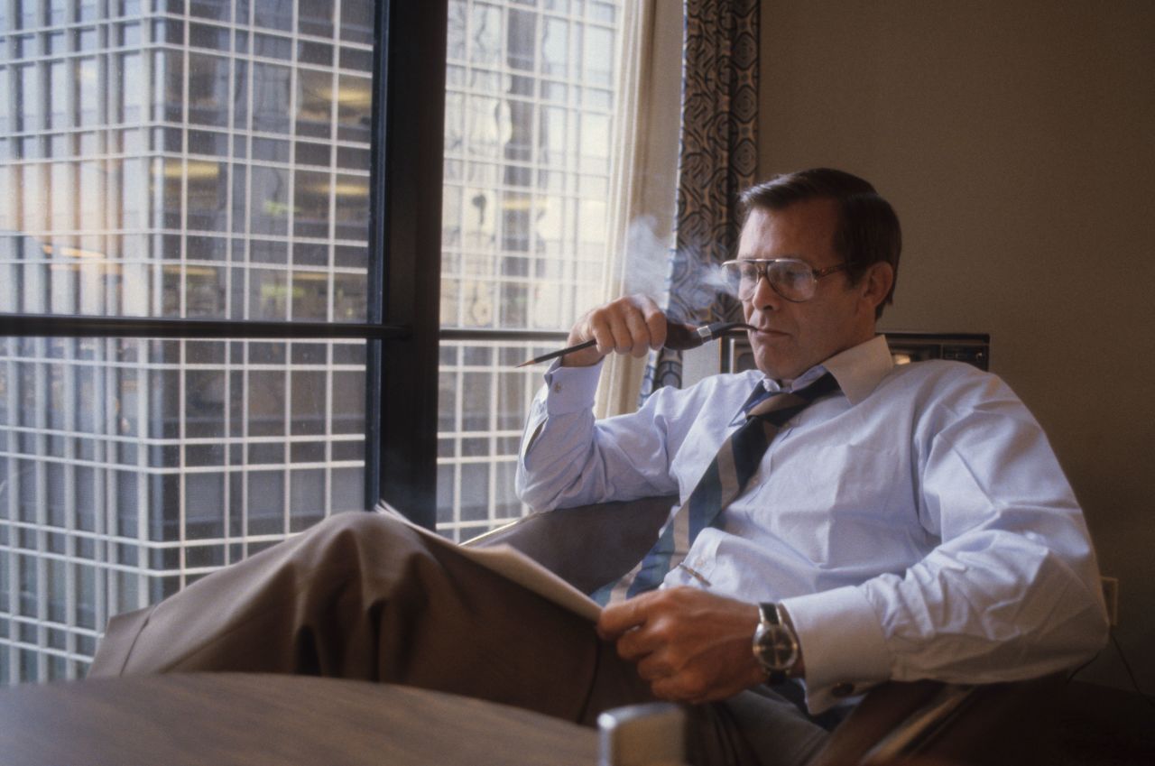 Rumsfeld smoke a pipe while sitting in Ford's suite during the Republican National Convention in 1980.