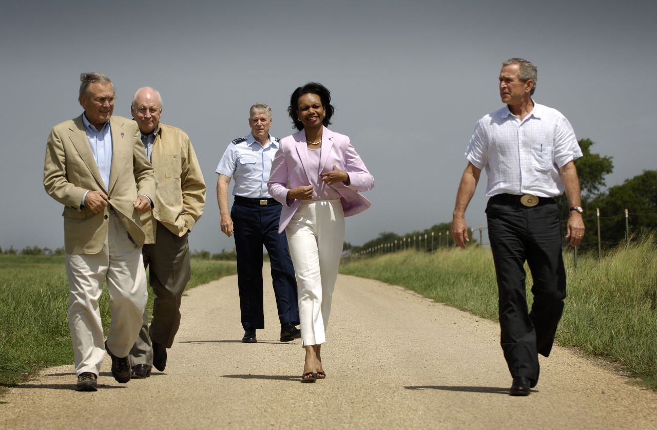From left, Rumsfeld, Vice President Dick Cheney, Chairman of the Joint Chiefs of Staff Gen. Richard Myers and Secretary of State Condoleezza Rice walk with Bush at the President's ranch in Crawford, Texas, in August 2005.