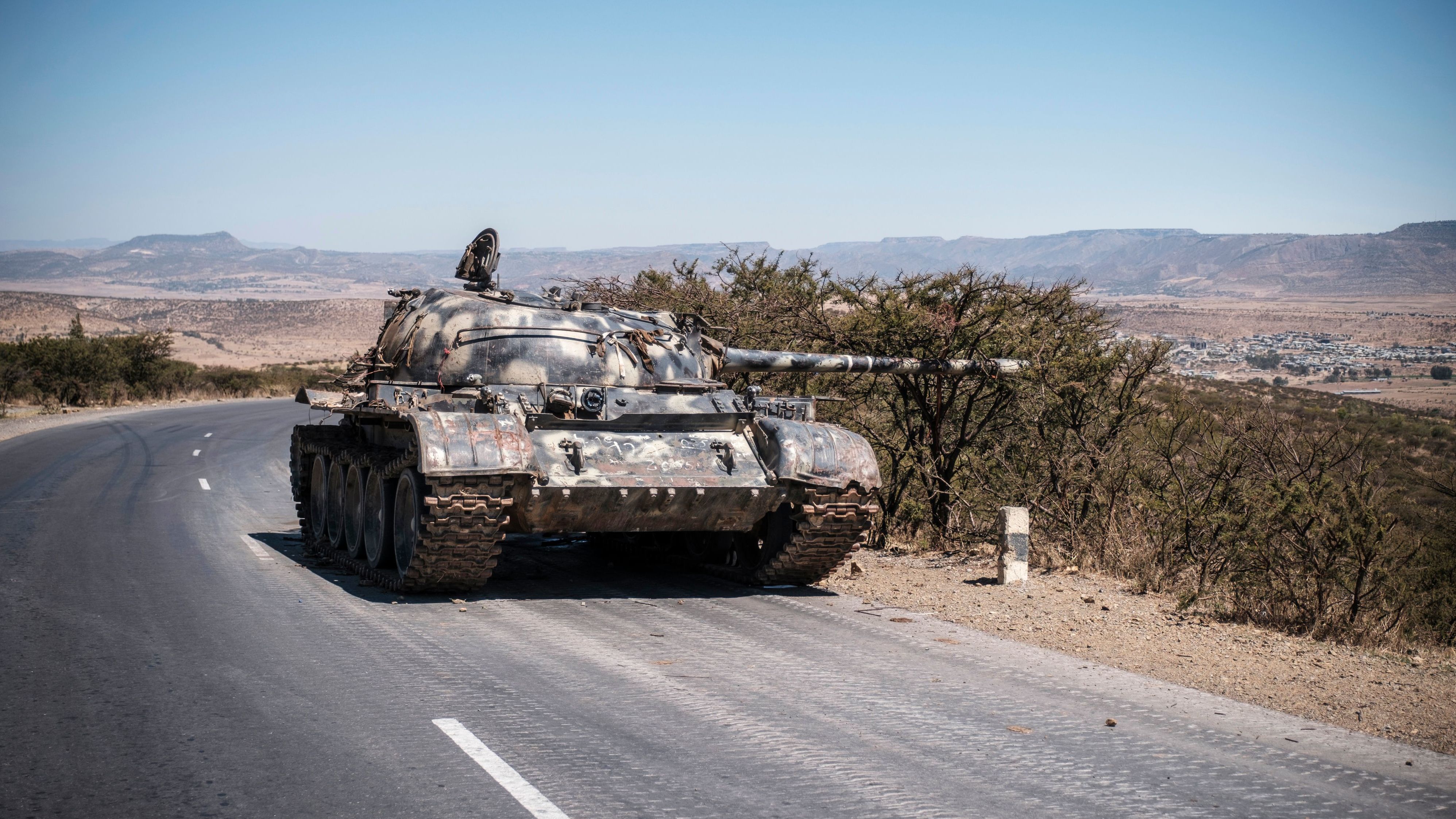 A damaged tank stands on a road north of Mekele, the capital of Tigray on February 26, 2021.