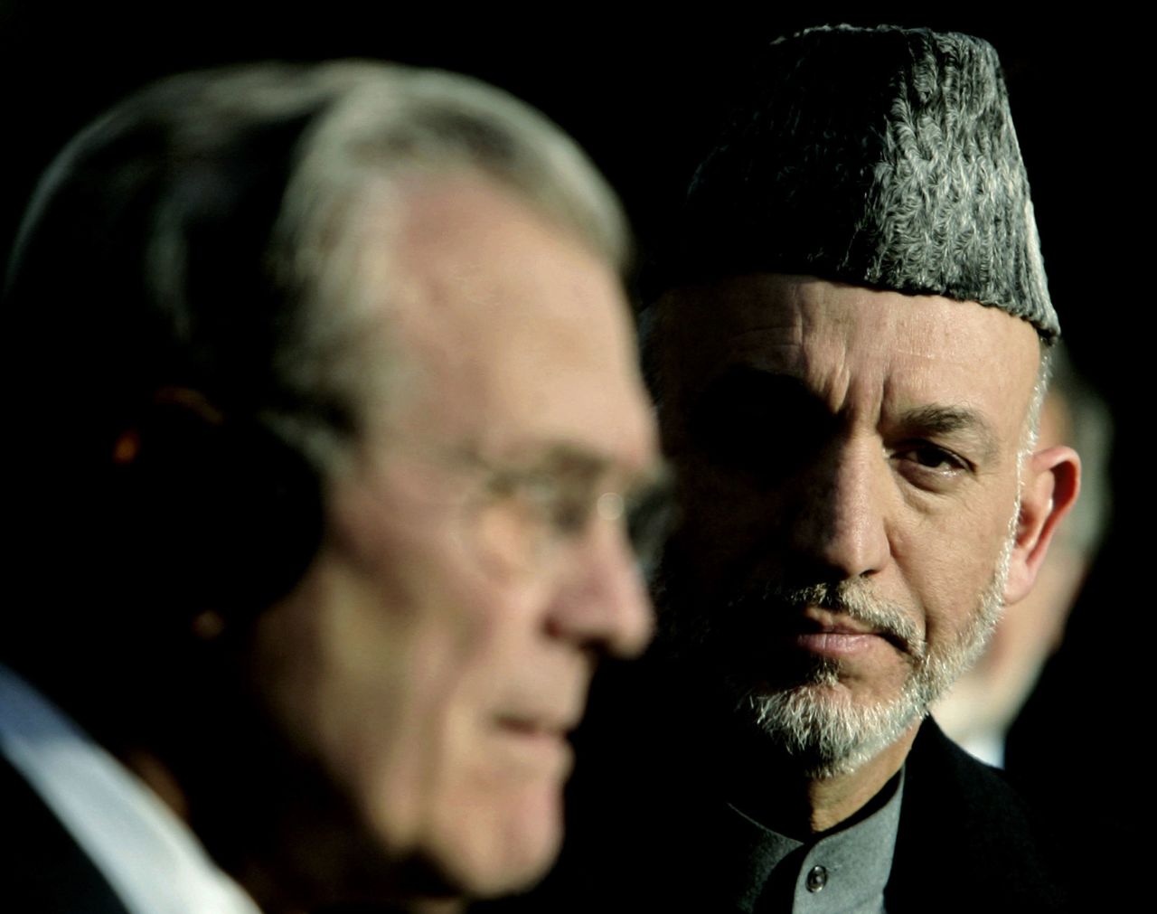 Rumsfeld holds a joint news conference with Afghan President Hamid Karzai in Kabul, Afghanistan, in December 2005. Rumsfeld told reporters that the United States was not going to abandon Afghanistan.