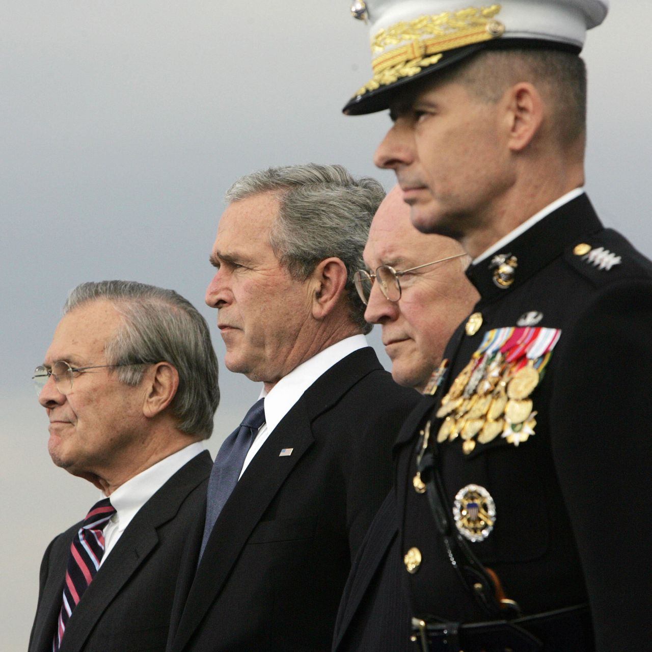 Rumsfeld, left, joins Bush, Cheney and Chairman of the Joint Chiefs of Staff Gen. Peter Pace for a Pentagon ceremony in December 2006. Bush was replacing Rumsfeld as secretary of defense.