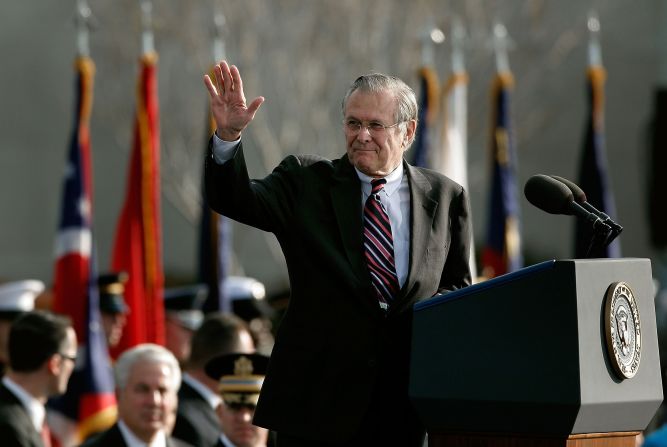 Rumsfeld waves after making remarks at his retirement ceremony in December 2006.