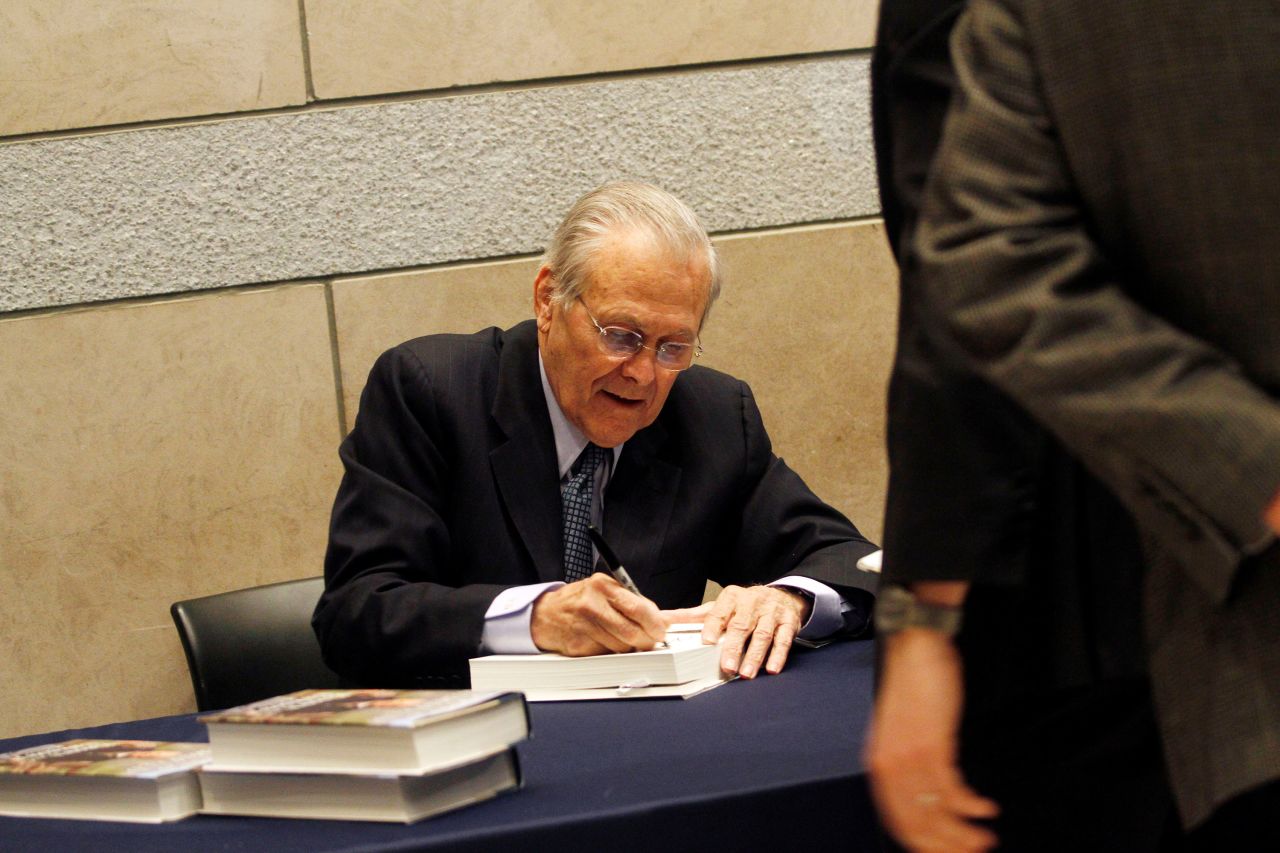 Rumsfeld signs books after speaking at the National Constitution Center in Philadelphia in 2011.