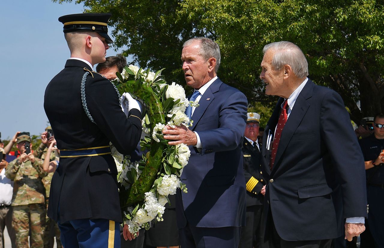 Rumsfeld and Bush take part in a wreath-laying ceremony at the Pentagon Memorial on the September 11 anniversary in 2019.