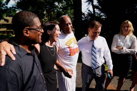 Cosby and members of his team speak to the media outside his home in Elkins Park, Pennsylvania, after his conviction was overturned and he was released from prison in June 2021.