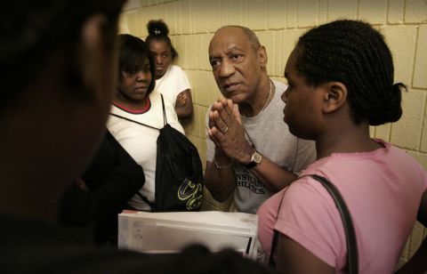 Students listen to Cosby after one of his town-hall forums in Milwaukee in August 2005. During his forums, Cosby talked to students and parents about taking responsibility for their actions.