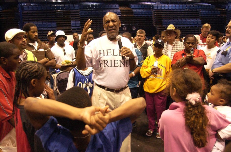 Cosby talks to Hurricane Katrina refugees in Houston in September 2005. His shirt reads "Hello, friend" — a tribute to his late son, Ennis, who used that as a regular greeting.