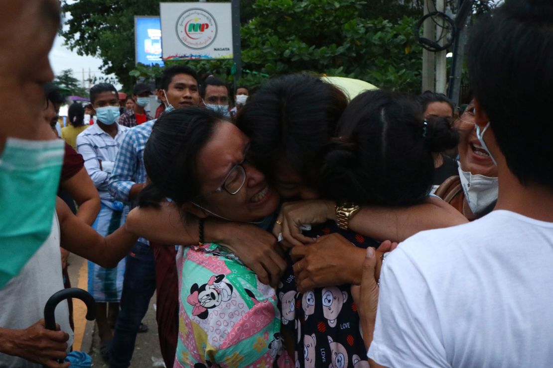 A man is hugged by two women after being released from Insein Prison in Yangon, Myanmar, on June 30.