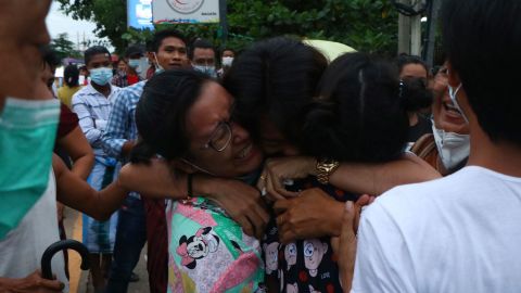 A man is hugged by two women after being released from Insein Prison in Yangon, Myanmar, on June 30.