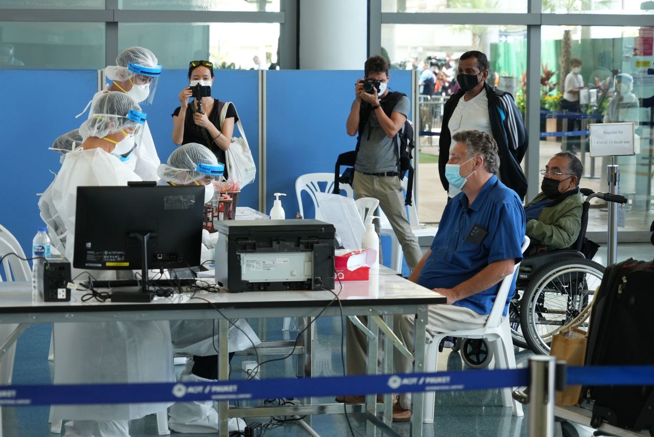 International travelers flying into Phuket must go through a series of screening checkpoints. 
