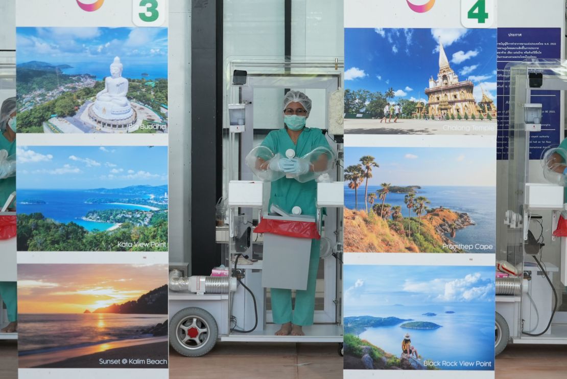 Phuket International Airport staff await incoming travelers on July 1, 2021.