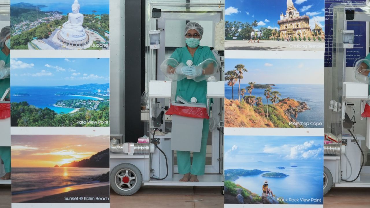 Phuket International Airport staff await incoming travelers on July 1, 2021. 