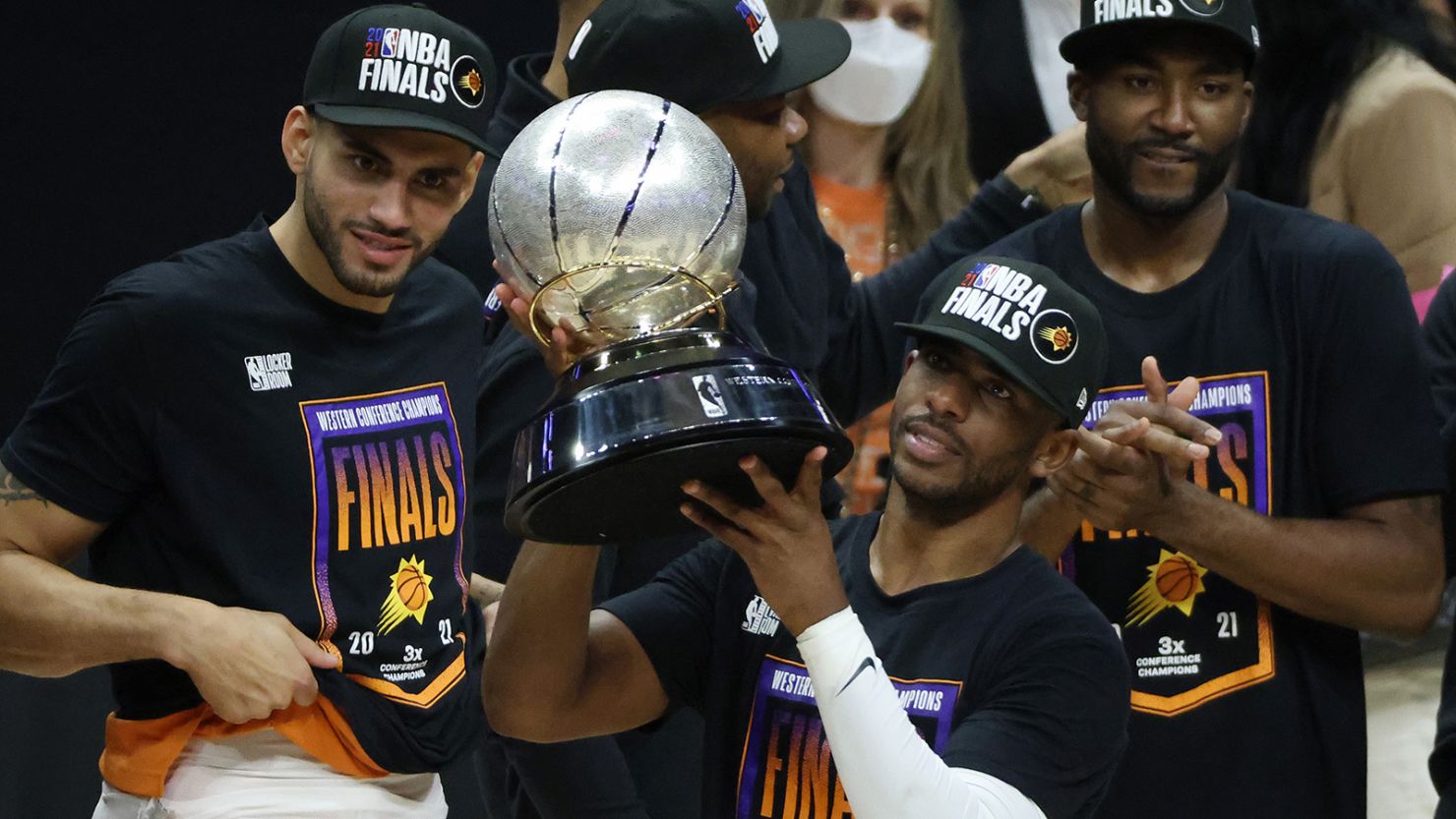 Chris Paul holds the Western Conference Championship trophy after the Suns defeated the LA Clippers.