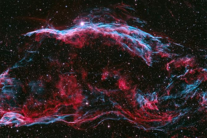 The Veil Nebula complex is the remnant of a giant supernova explosion, and this image shows only a part of the complex as the entire nebula is around six times the diameter of the full moon.