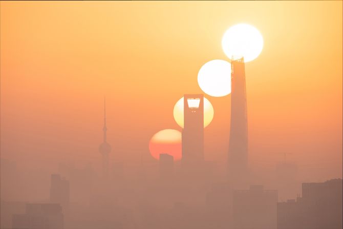 Taken in Shanghai, this image, composed of four different exposures from the same perspective, records the process of the sun rising.