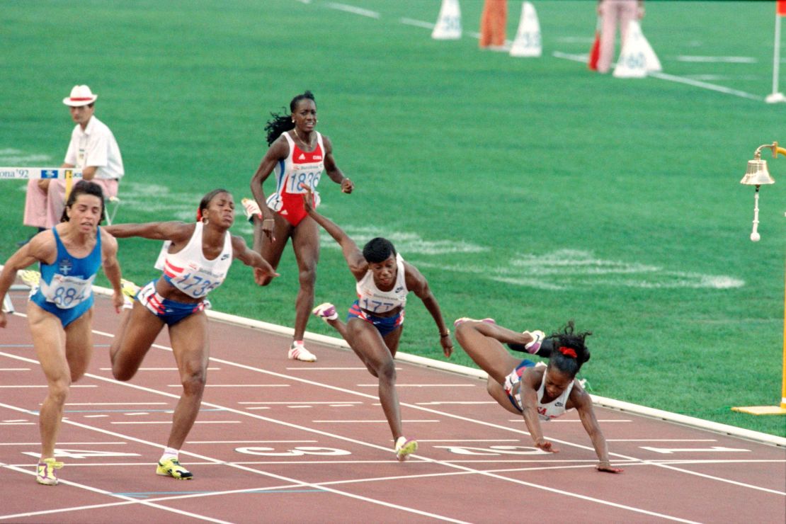 Devers (right) dives across the finish line of the 100m hurdles final at the 1992 Olympics having hit the last hurdle. 