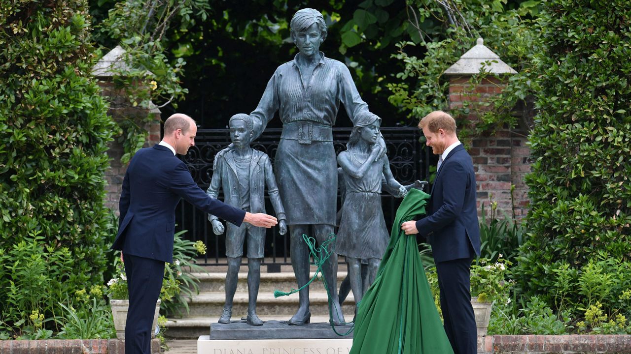 Britain's Prince William, left and Prince Harry unveil a statue they commissioned of their mother Princess Diana,  on what woud have been her 60th birthday, in the Sunken Garden at Kensington Palace, London, Thursday July 1, 2021. (Dominic Lipinski /Pool Photo via AP)