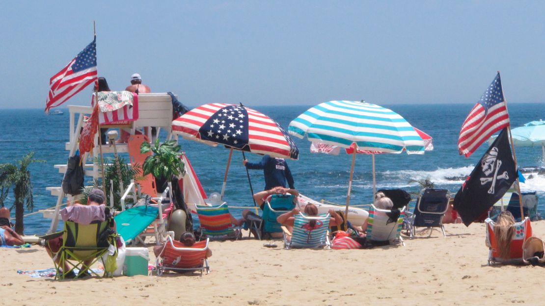 Flags line the beach in Belmar, New Jersey, on June 28, 2020. Families gathering for the Fourth of July weekend can exercise these safety tips. 