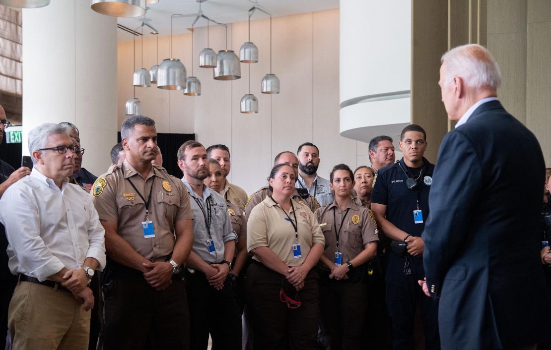 US President Joe Biden greets first responders to the collapse of the 12-story Champlain Towers South condo building in Surfside, during a meeting with them in Miami Beach, Florida, July 1, 2021. - President Joe Biden flew to Florida on Thursday to "comfort" families of people killed or still missing in the rubble of a beachfront apartment building, where hopes of finding survivors had all but evaporated. Biden and First Lady Jill Biden left the White House early for the flight to Miami, and then traveled by motorcade to nearby Surfside, where the death toll in the tragedy now stands at 18, and more than 140 still unaccounted for. (Photo by SAUL LOEB / AFP) (Photo by SAUL LOEB/AFP via Getty Images)