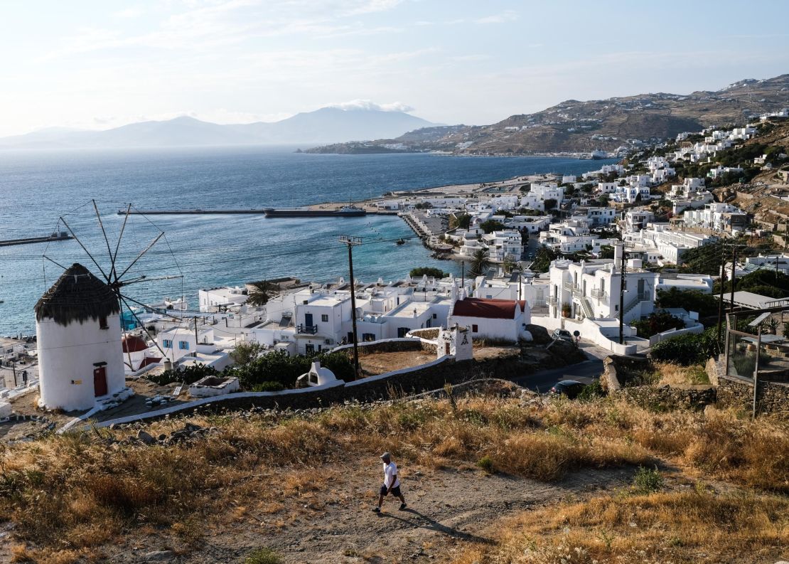 A view of Bonis Windmill and the Old Port of Mykonos, one of the most popular islands in Greece. 