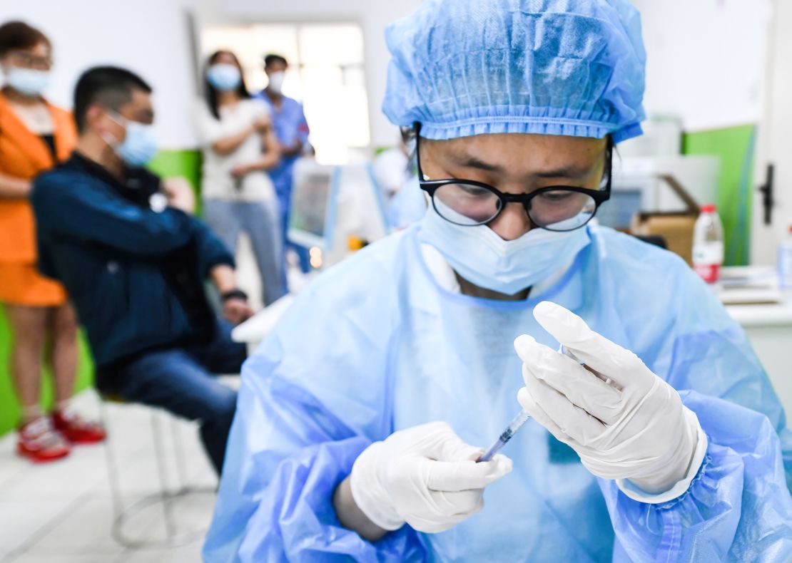 A health worker in China prepares to administer a dose of Sinopharm's Covid-19 vaccine.
