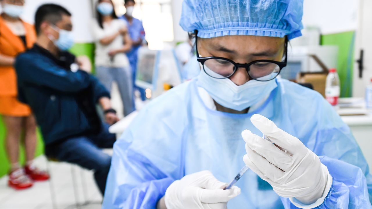 A health worker in China prepares to administer a dose of Sinopharm's Covid-19 vaccine.
