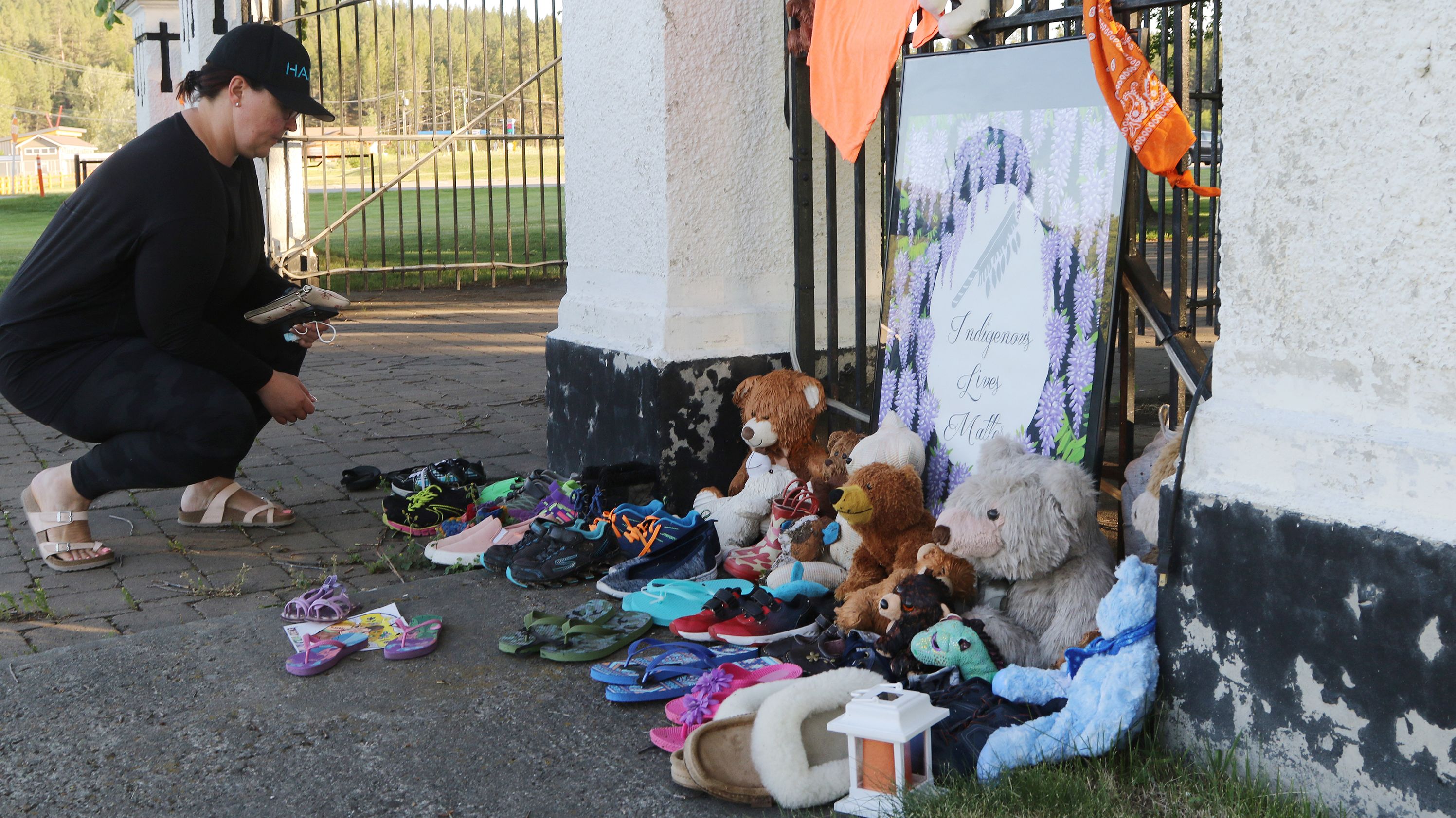 Lucy Sager, visits a growing memorial near the site of the former residential school.