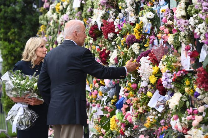 President Joe Biden and first lady Jill Biden visit a memorial near the partially collapsed building on July 1. <a href="index.php?page=&url=https%3A%2F%2Fwww.cnn.com%2F2021%2F07%2F01%2Fpolitics%2Fjoe-biden-south-florida-visit%2Findex.html" target="_blank">Biden traveled to Surfside</a> to console families still waiting on news of their loved ones. Those meetings were closed to the press.