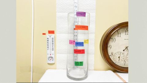 We kept track of how many pints of water were collected by each dehumidifier over a test period using color-coded tape we affixed to the water line on the outside of a tall glass vase.