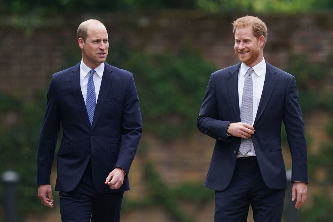 Prince William, left, and Prince Harry, right, arrive for the unveiling of a statue of their mother, Princess Diana, in the Sunken Garden in Kensington Palace.