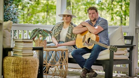 Emily and Ben Roberts, the husband-and-wife duo of Carolina Story, on their front porch outside of Nashville.