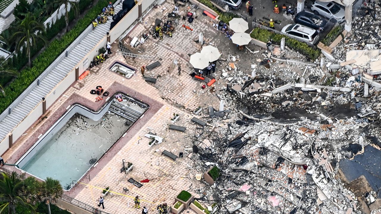 Search and rescue personnel work on site after the partial collapse of the Champlain Towers South.