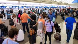 Santa Ana, CA - June 29: Travelers wait in line during check in at John Wayne Airport in Santa Ana, CA on Wednesday, June 30, 2021. Free from most of the COVID-19 restrictions, many people are traveling and taking advantage of the long July 4th weekend. (Photo by Paul Bersebach/MediaNews Group/Orange County Register via Getty Images)