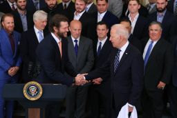 Los Angeles Dodgers pitcher Clayton Kershaw (L) shakes hands with U.S. President Joe Biden during a celebration of the team's 2020 World Series championship in the East Room of the White House on July 02, 2021 in Washington, DC. 