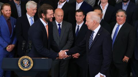 Los Angeles Dodgers pitcher Clayton Kershaw (L) shakes hands with U.S. President Joe Biden during a celebration of the team's 2020 World Series championship in the East Room of the White House on July 02, 2021 in Washington, DC. 
