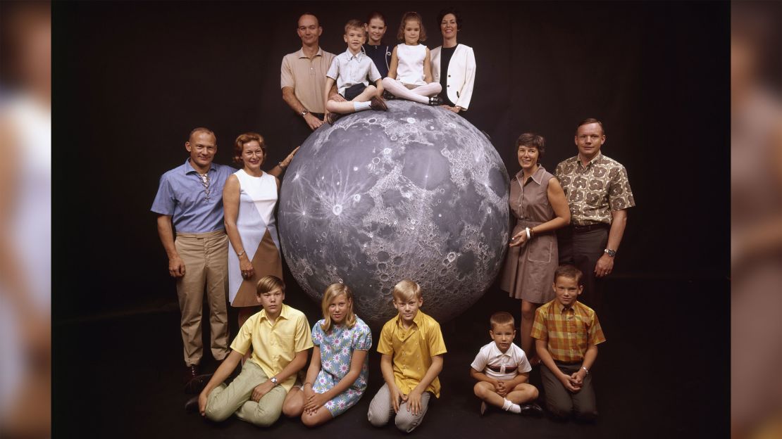 A group portrait of the Apollo 11 astronauts and their families. At the top, from left: astronaut Michael Collins, his children Mike, Kate and Ann, and his wife, Pat; at left, astronaut Buzz Aldrin, his wife, Joan, and children Mike, Jan, and Andy; at right, astronaut Neil Armstrong with his wife, Janet, and children Rick and Mark.