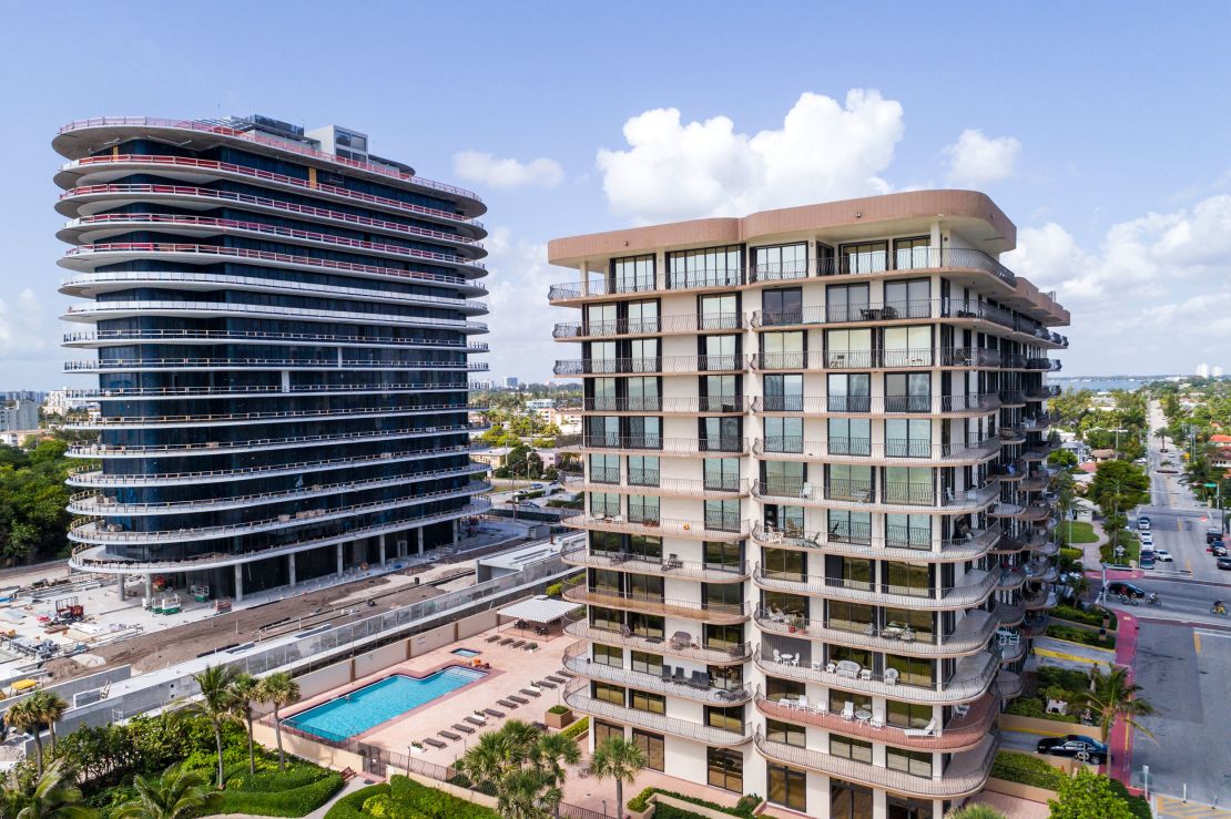 Ultra-luxury high rise to the left, and Champlain Towers South on the right.