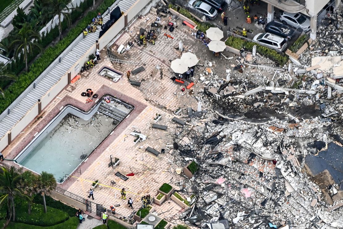 This aerial view shows search and rescue personnel working on site after the partial collapse of the Champlain Towers South in Surfside, Florida, on June 24, 2021. 