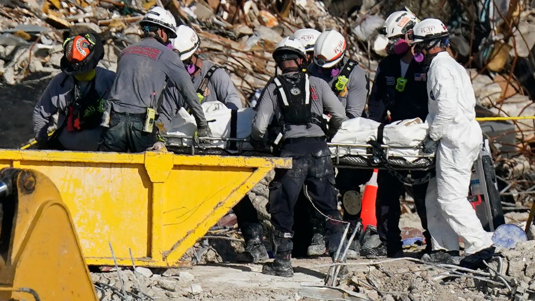 Search-and-rescue personnel work at the site on July 2.