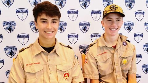Boy Scouts Dominic Viet, left, and Joseph Diener saved a woman from drowning in floodwaters.