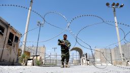 An Afghan National Army soldier stands guard at the gate of Bagram U.S. air base, on the day the last of American troops vacated it, Parwan province, Afghanistan July 2, 2021. REUTERS/Mohammad Ismail     TPX IMAGES OF THE DAY
