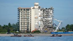 U.S. Coast Guard boats patrol in front of the partially collapsed Champlain Towers South condo building, ahead of a planned visit to the site by President Joe Biden, on Thursday, July 1, 2021, in Surfside, Fla. Rescue efforts at the site of the partially collapsed condominium building were halted Thursday out of concern about the stability of the remaining structure, officials said.(AP Photo/Mark Humphrey)