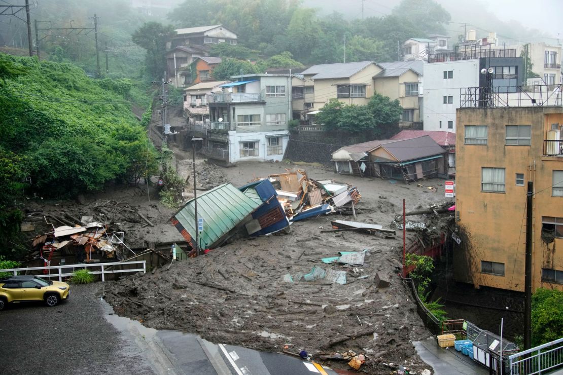 Houses are damaged by mudslide following heavy rain at Izusan district in Atami.