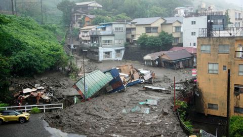 Houses are damaged by mudslide following heavy rain at Izusan district in Atami.