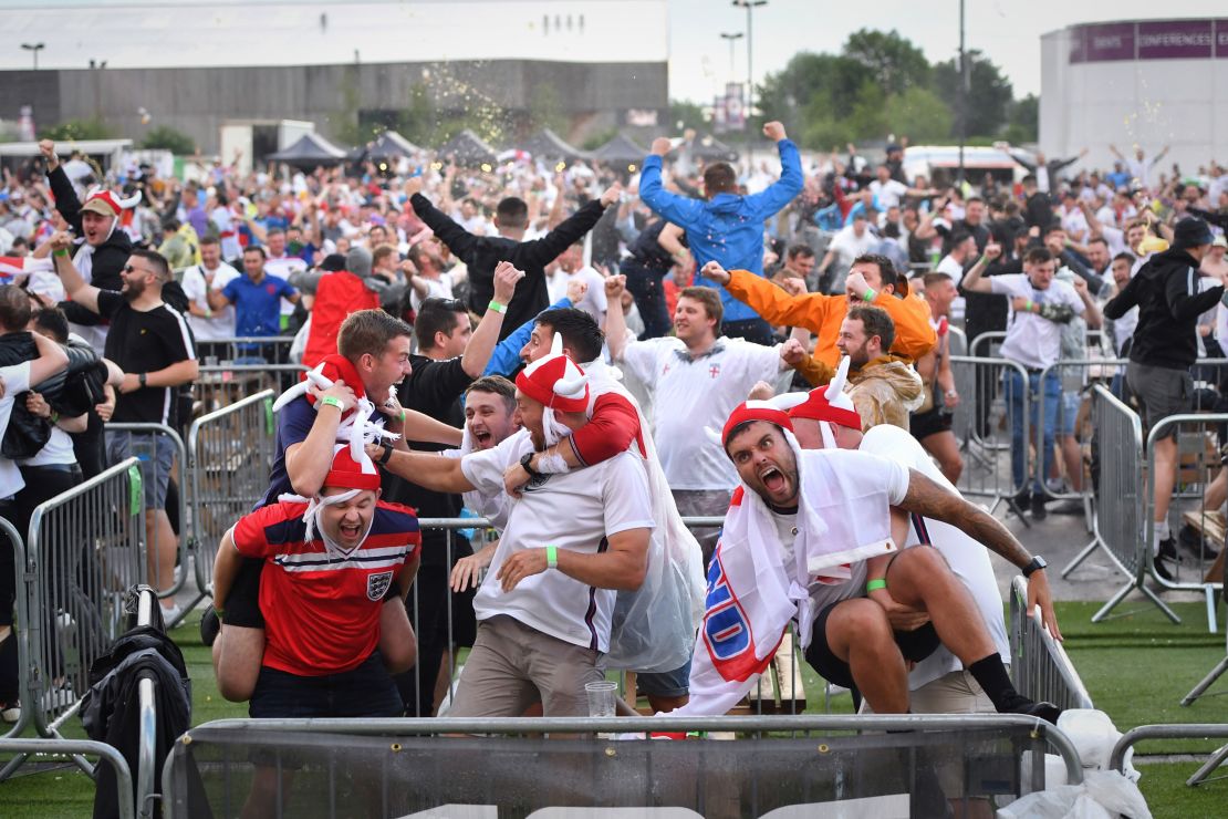 England supporters celebrate Kane's first goal at the 4TheFans Fan Park at Event City in Manchester.