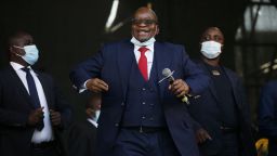 Former South African President Jacob Zuma dances on stage before addressing his supporters following the postponement of his corruption trial outside the Pietermaritzburg High Court in Pietermaritzburg, South Africa, on May 26, 2021. (Photo by Phill Magakoe / AFP) (Photo by PHILL MAGAKOE/AFP via Getty Images)