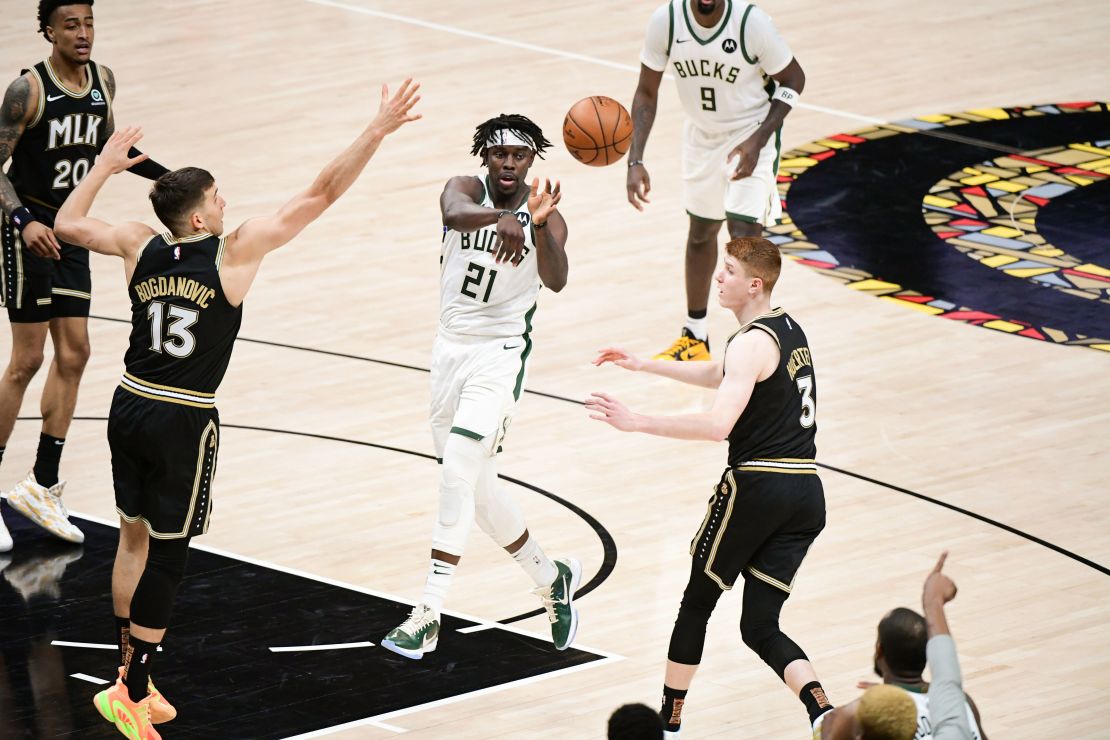 Jrue Holiday #21 of the Milwaukee Bucks passes the ball during the game against the Atlanta Hawks during Game 6 of the Eastern Conference Finals of the 2021 NBA Playoffs on July 3, 2021 at State Farm Arena in Atlanta, Georgia.