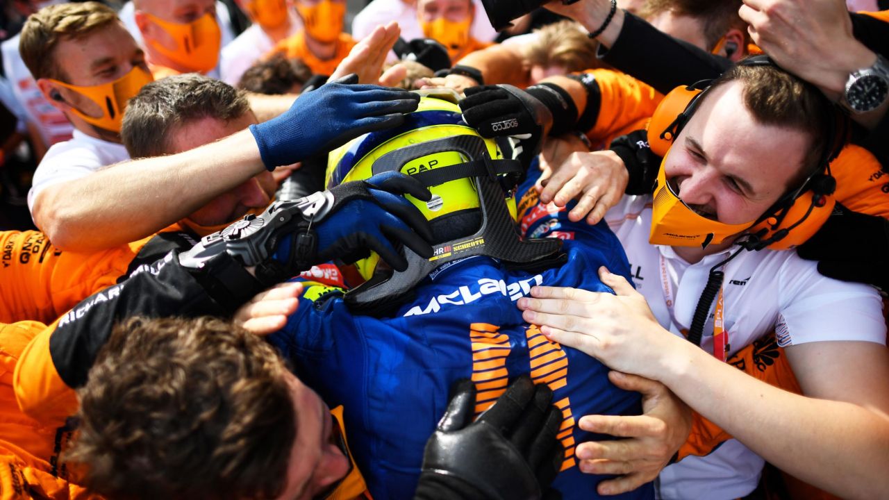 Norris enthusiastically celebrates his podium finish.